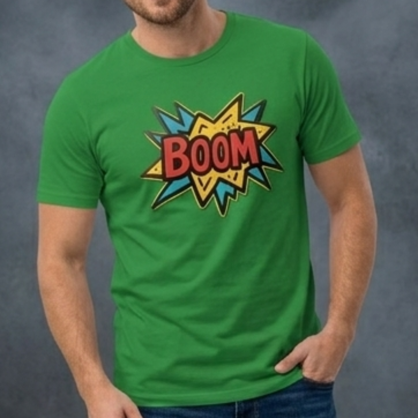Man wearing a green t-shirt with a colorful 'BOOM' design on a dark background