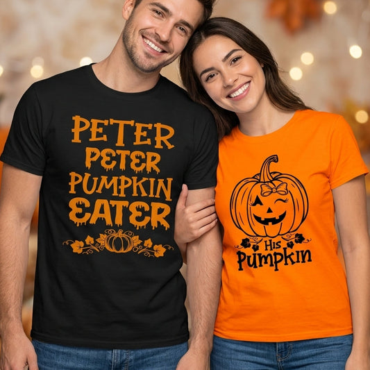 A man and a woman standing together in a cozy, decorated autumn setting. The man wears a black t-shirt with orange text reading 'PETER PETER PUMPKIN EATER', and the woman wears an orange t-shirt with a black pumpkin graphic and the text 'is His Pumpkin'.